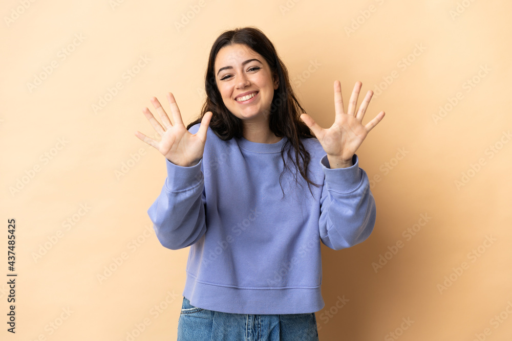 Young caucasian woman over isolated background counting ten with fingers Young caucasian woman over isolated background counting ten with fingers