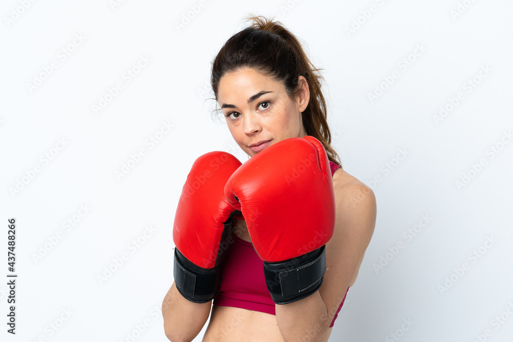 Sport woman over isolated white background with boxing gloves