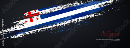 Grunge brush of Adjara flag on shiny black background. Creative glitter sparkle brush paint vector illustration