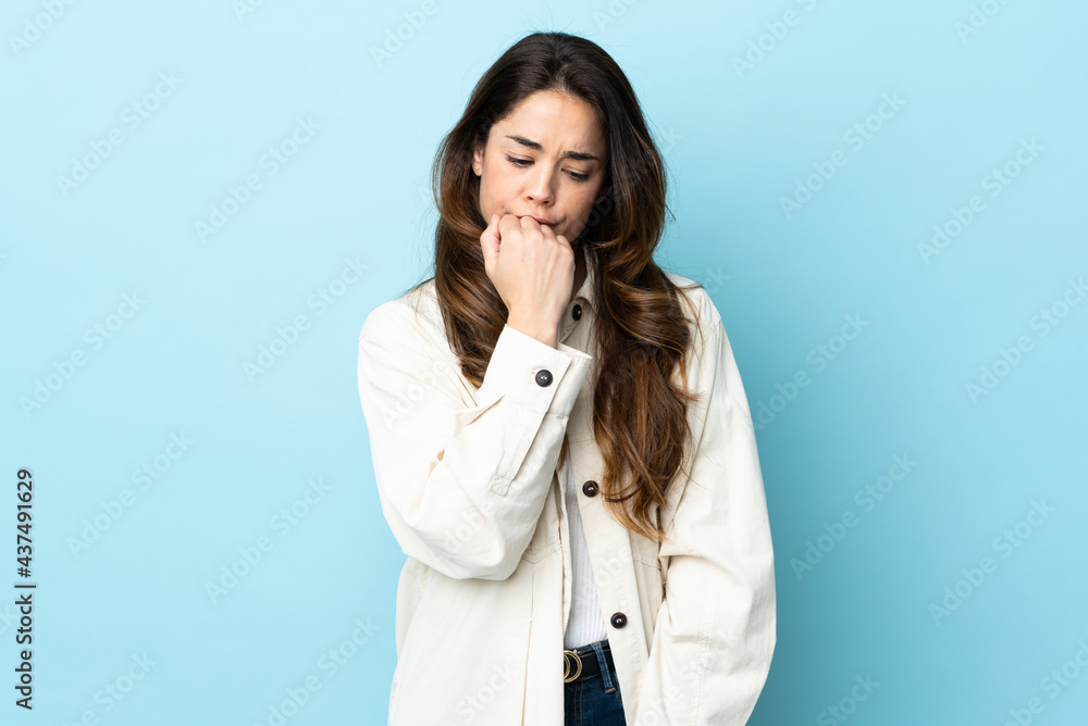 Woman over isolated background having doubts Woman over isolated background having doubts