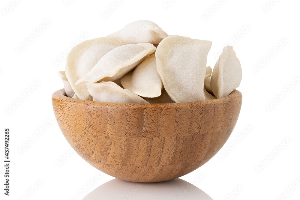 frozen dumplings in wooden bowl isolated on white background