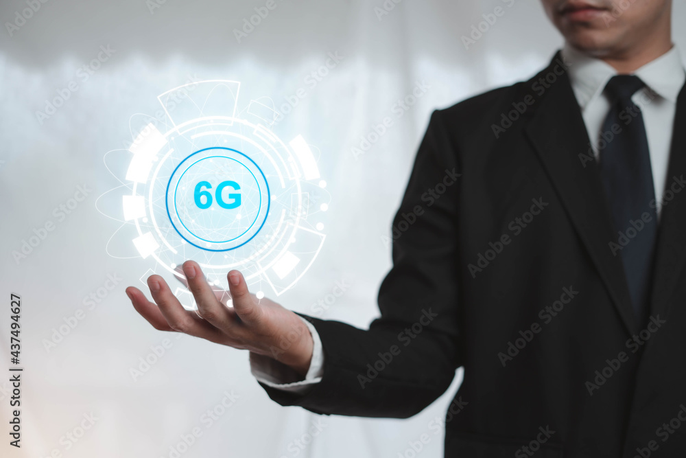 Businessman holding Internet network 6G wireless system that is online around the world to access quickly, develop future technologies, high-speed mobile Internet. concept, modern network technology. Businessman holding Internet network 6G wireless system that is online around the world to access quickly, develop future technologies, high-speed mobile Internet. concept, modern network technology.