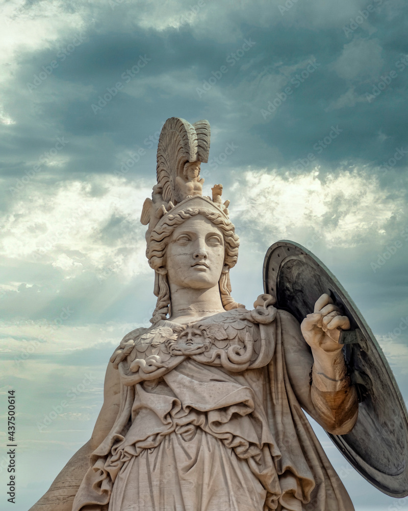 Obraz premium Athena, the ancient Greek goddess of wisdom and knowledge under dramatic cloudy sky, Athens Greece