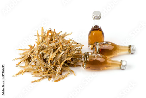 Dried anchovy and fish sauce isolated on white background.