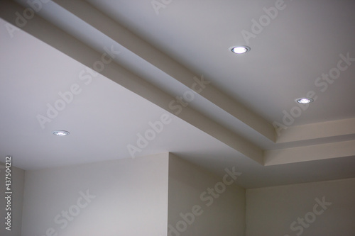 The walls and ceiling have just been painted white. Construction work of a bricklayer in Thailand. Background image