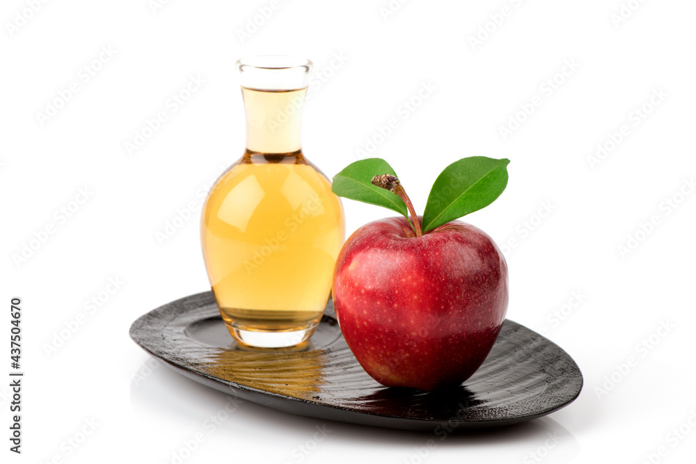 Apple fruit and apple cider vinegar isolated on white background.