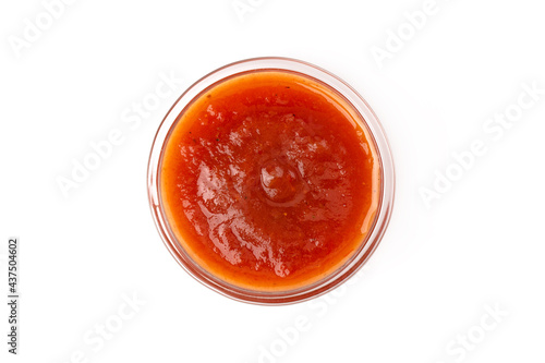Bowl of tomato sauce, isolated on white background. Top view.