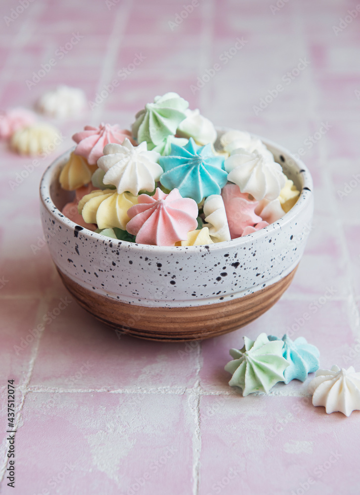 Small colorful meringues in the ceramic bowl Small colorful meringues in the ceramic bowl