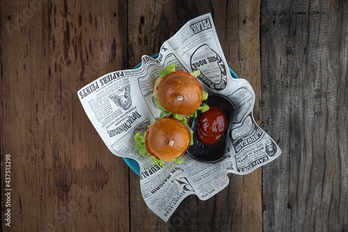 Top view of two mini beef burgers with beetroot relish. Beef patties on two brioche buns with lettuce and beetroot photo