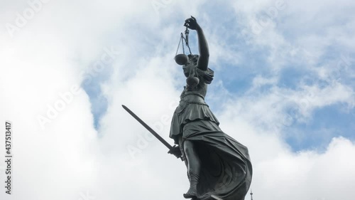 Moving clouds over the statue of Justitia, Frankfurt am Main, Hesse, Germany