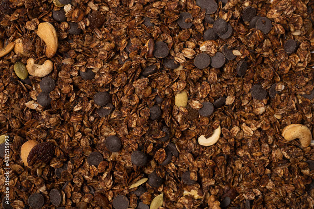 Chocolate granola cereal with nuts background. Chocolate granola cereal with nuts background.