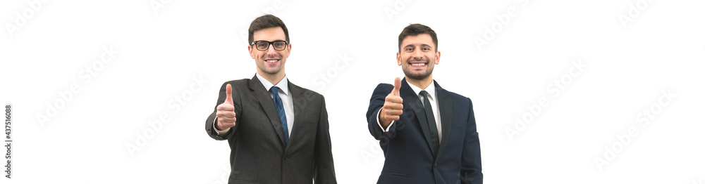 The two businessmen thumb up on the white wall background The two businessmen thumb up on the white wall background