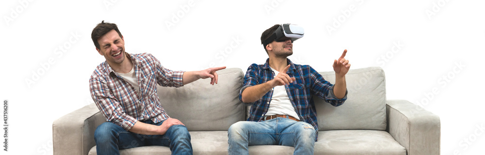 The two men with virtual glasses gesture on a sofa on a white wall background The two men with virtual glasses gesture on a sofa on a white wall background