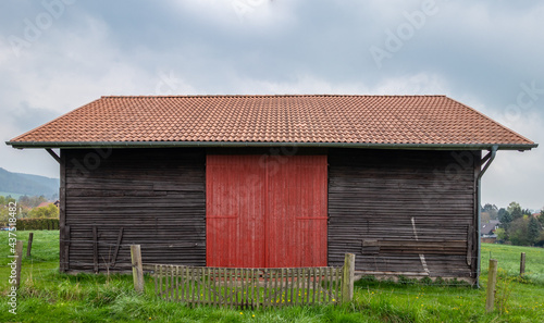 Old barn in the meadow in Germany