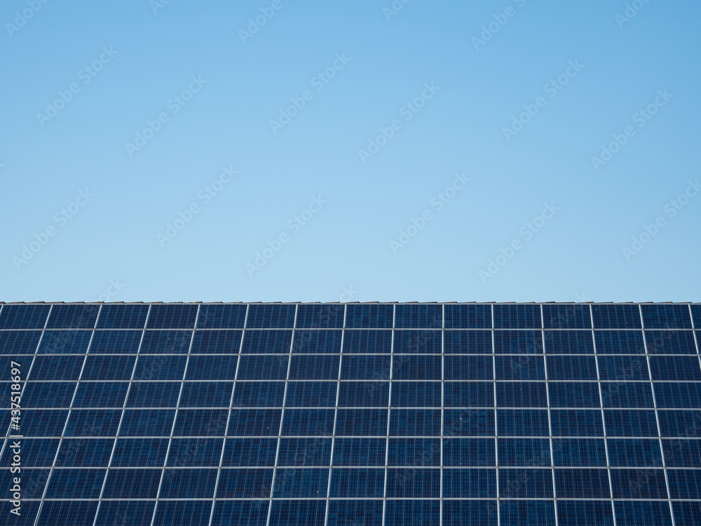 solar panel against blue sky in sunshine solar panel against blue sky in sunshine