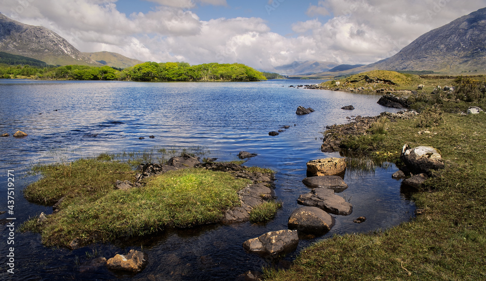 Beautiful landscape scenery of lough inagh with mountains and trees in the background at Connemara National park in county Galway, Ireland 