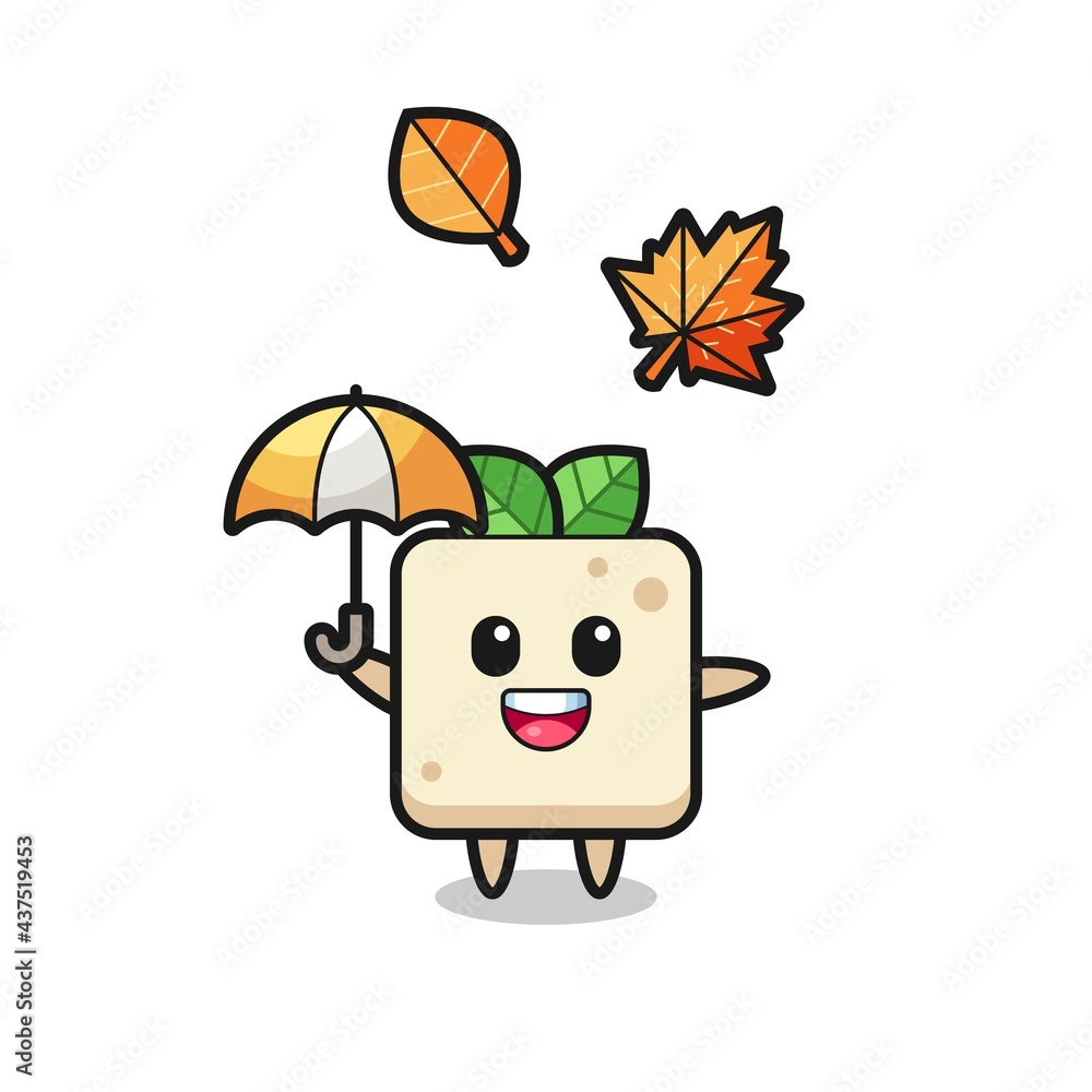 Fototapeta premium cartoon of the cute tofu holding an umbrella in autumn