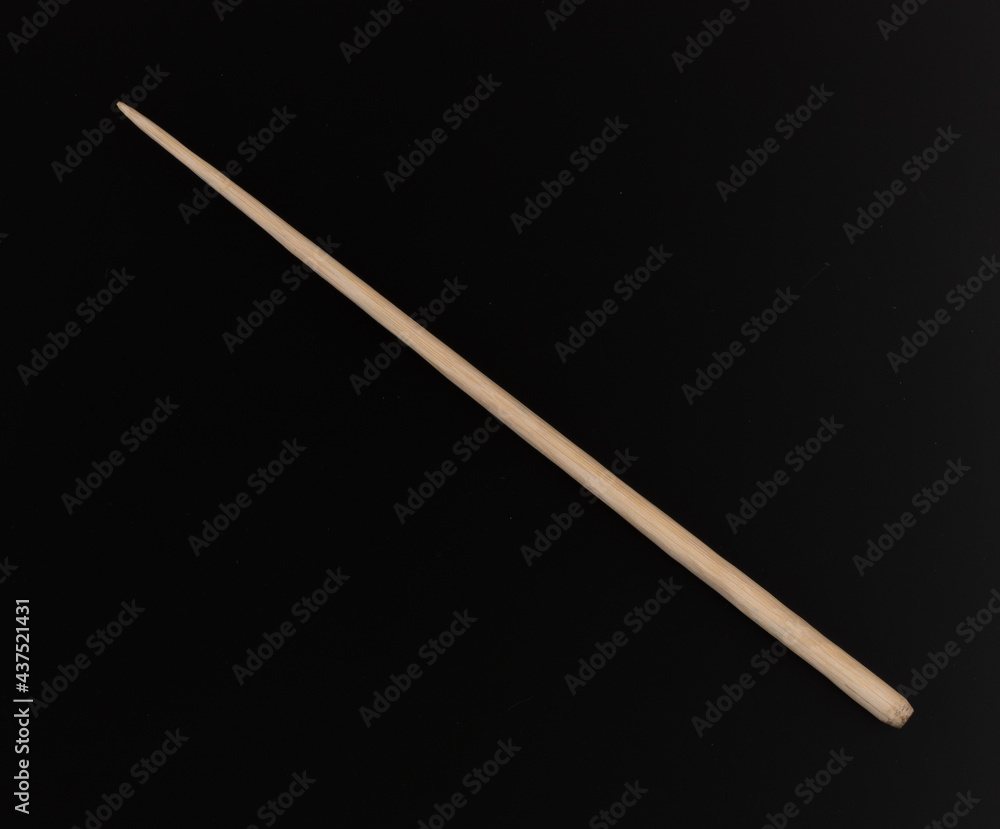 conductor stick isolated on black background conductor stick isolated on black background