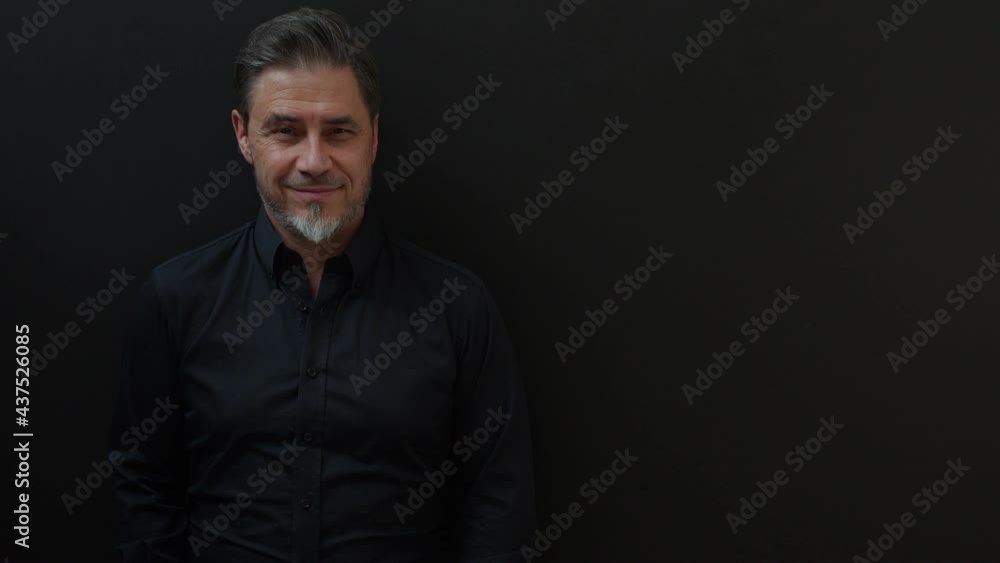 Confident businessman smiling. Portrait of mature age, middle age, mid adult man in 50s, happy confident smile. Copyspace. Confident businessman smiling. Portrait of mature age, middle age, mid adult man in 50s, happy confident smile. Copyspace.
