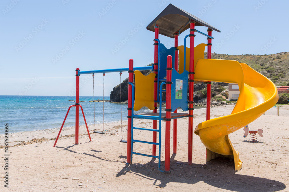 Children's playground with slide, swings and climbing area, located on the shore of the Spanish beach of Puntas de Calnegre. Children's playground with slide, swings and climbing area, located on the shore of the Spanish beach of Puntas de Calnegre.