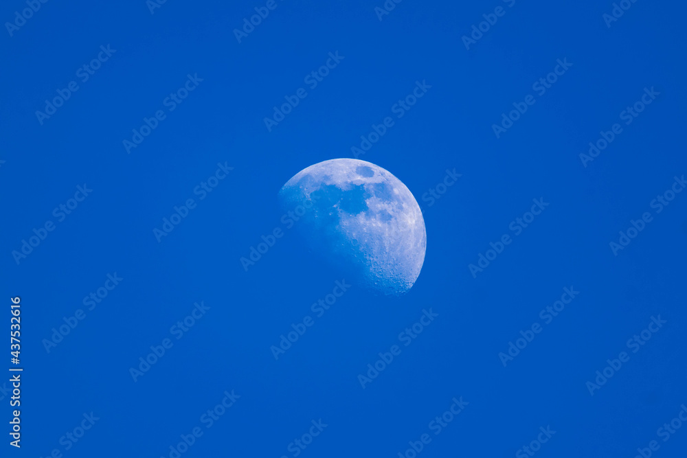 half moon with blue sky background half moon with blue sky background