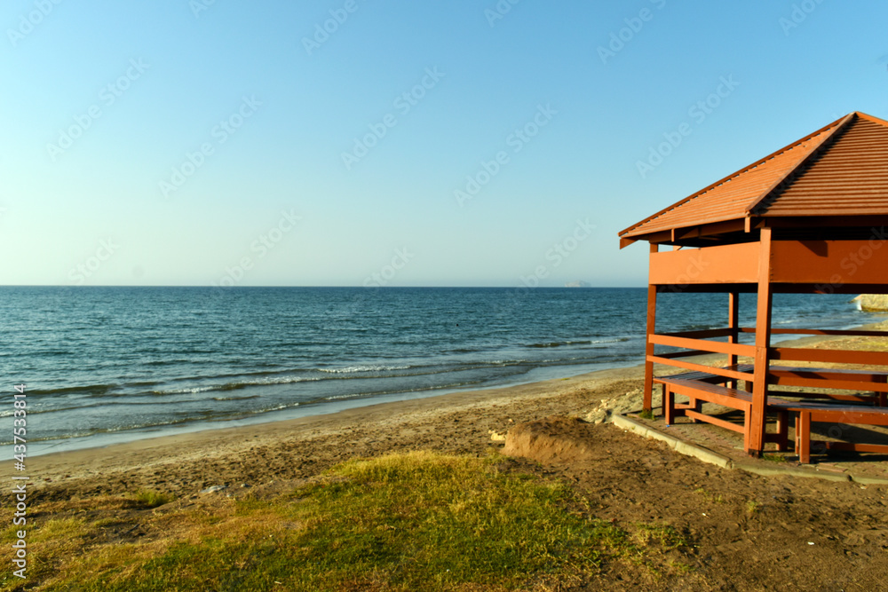 beach hut on the beach at sunset