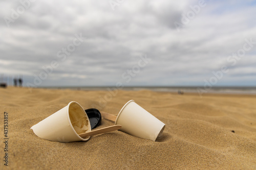 Close up coffee cups litter on the beach