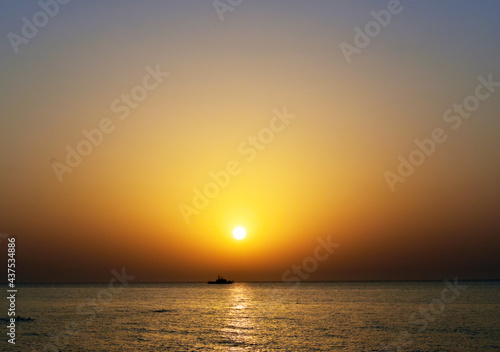 sunset over the sea © Taksira