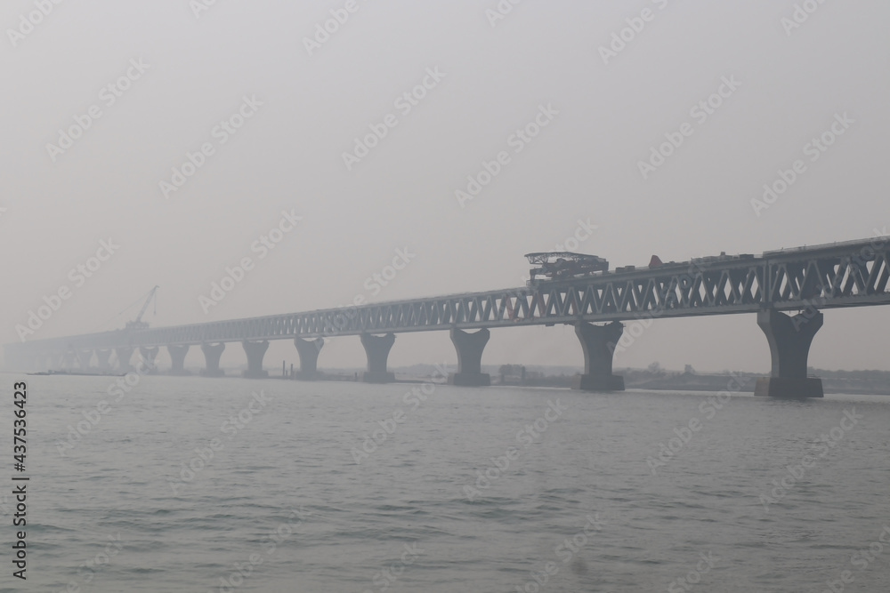 The Padma bridge running construction up the river. The Padma bridge running construction up the river.
