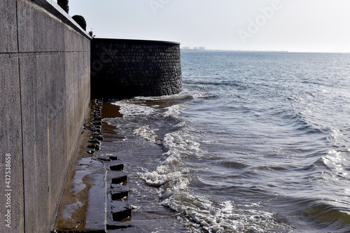 waves of the sea hit the wall