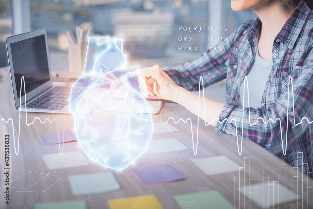 Double exposure of woman hands typing on computer and heart hologram drawing. Education concept. Double exposure of woman hands typing on computer and heart hologram drawing. Education concept.