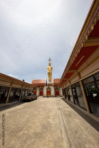 big standing buddha at Wat Moonjinda temple photo