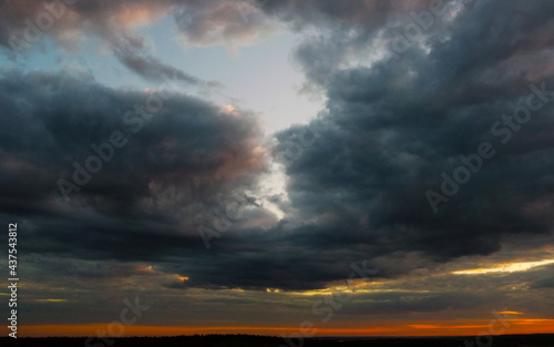 Beautiful contrasting clouds in the sky at sunset. Background for design