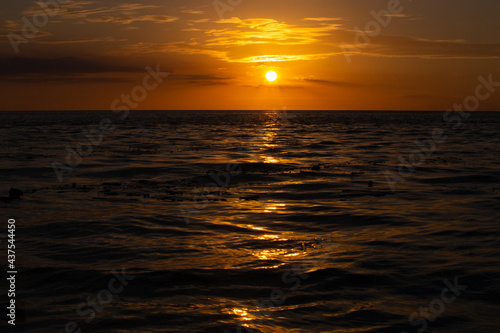 sunset in the middle of the sea