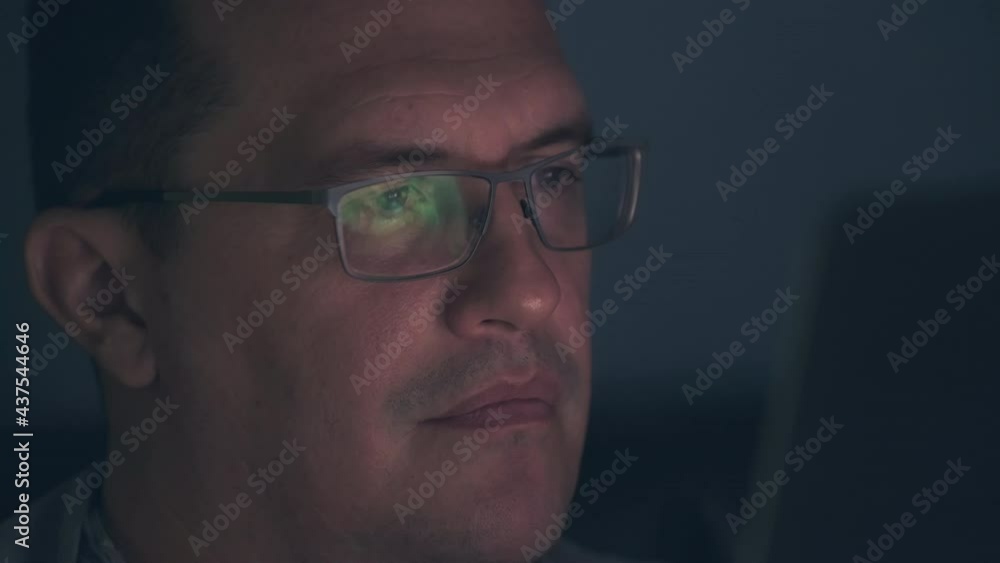 Adult man in front of computer Adult man in front of computer