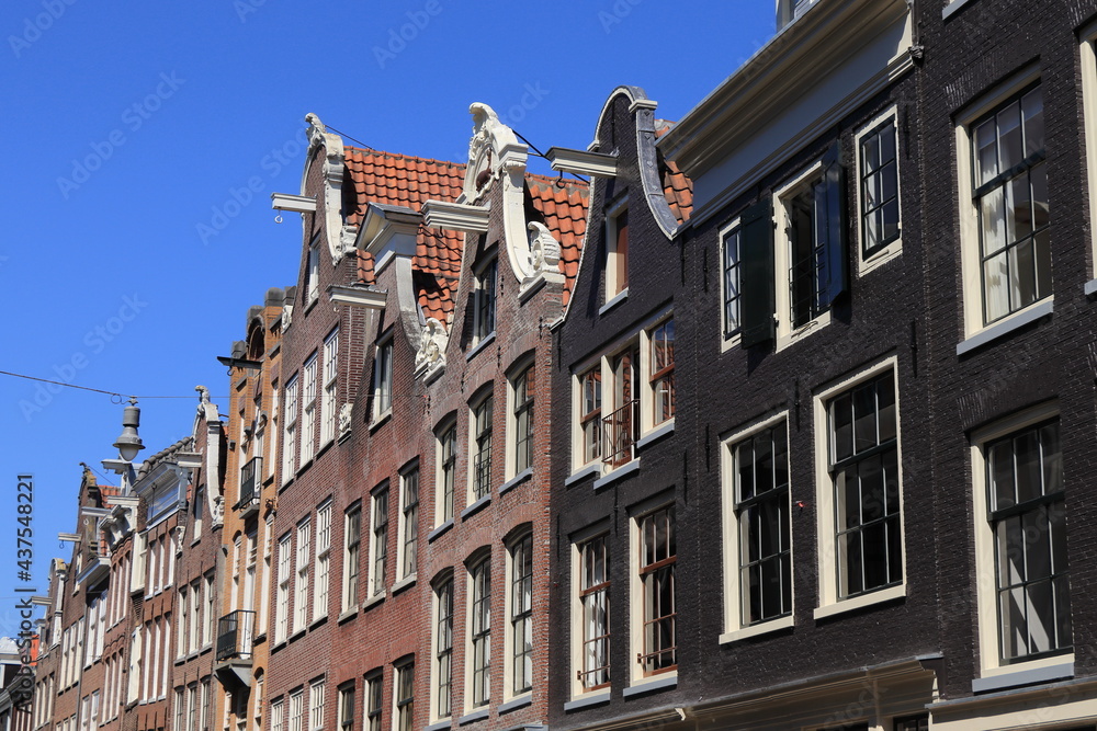 Amsterdam Traditional Historic House Facades with Bell Gables Against a Blue Sky