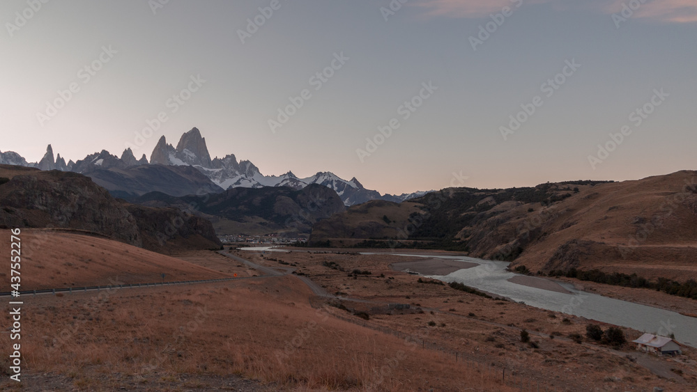 Sunset in the Mountains. El Chalten Road, Patagonia, Argentina. River de las Vueltas and Fiz Roy Mountain on a Evening Sky Background. Los Glacieres National Park. 