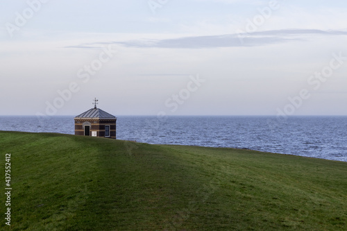 Seahouse near Hindeloopen and the IJsselmeer during a day with clear skies and calm water/seas. Friesland province, the Netherlands