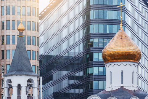 Domes of the churches on office buildings background. photo