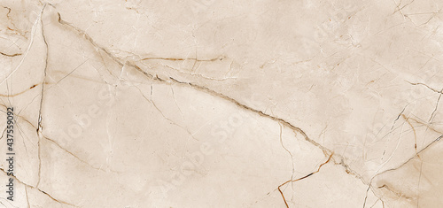 ivory-gold marble stone texture, Intertwined with dark brown streaks, Marble is a hard rock granite and applicability in modern home decor - such as ceramic wall tile exterior-interior, kitchen tile.