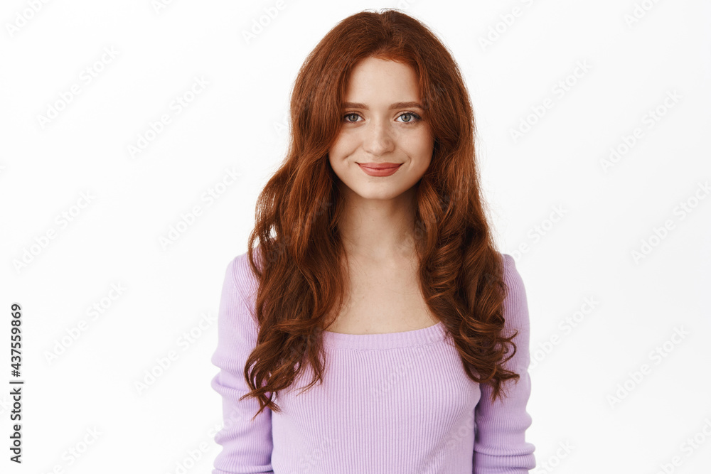 Beautiful romantic girl with red hair, purple elegant blouse, smiling sweet and tender at camera, standing against white background Beautiful romantic girl with red hair, purple elegant blouse, smiling sweet and tender at camera, standing against white background