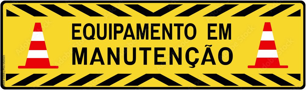 A sign that says : equipment under maintenance in portuguese language. A sign that says : equipment under maintenance in portuguese language.