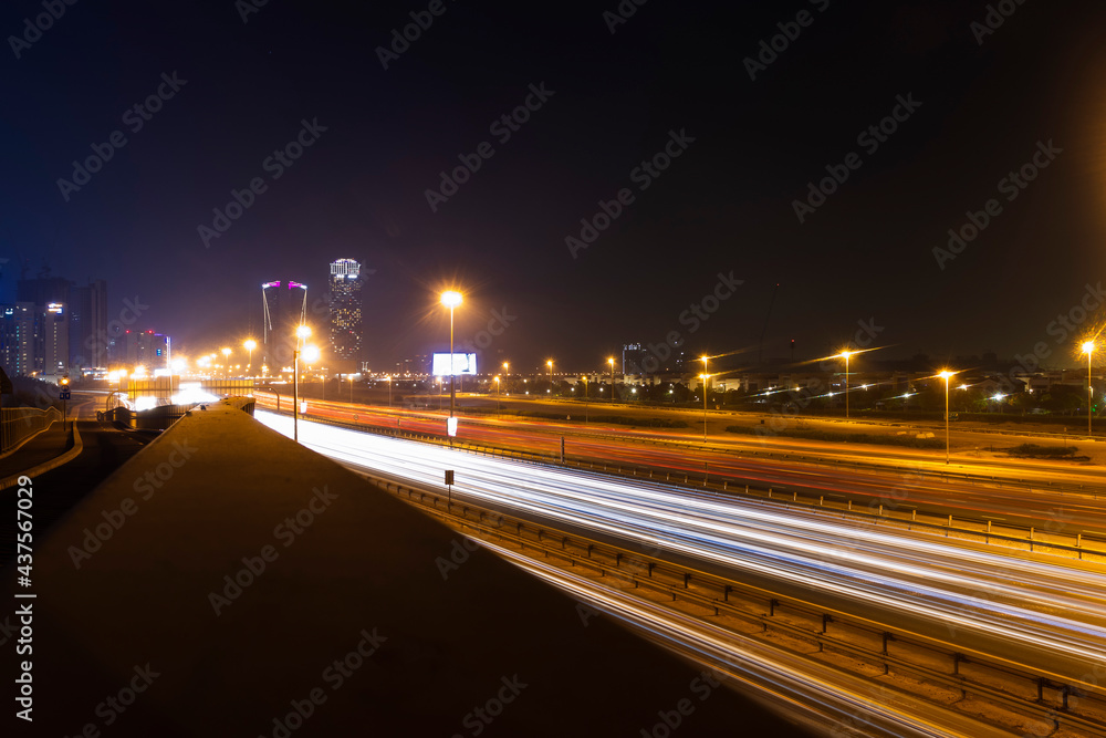 Dubai, UAE - 06.04.2021 Light trails on Al Khail road at night. Urban