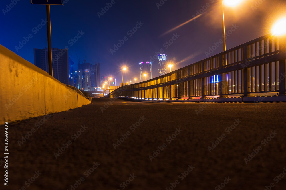 Dubai, UAE - 06.04.2021 Cycling track along Al Khail road at night, Urban