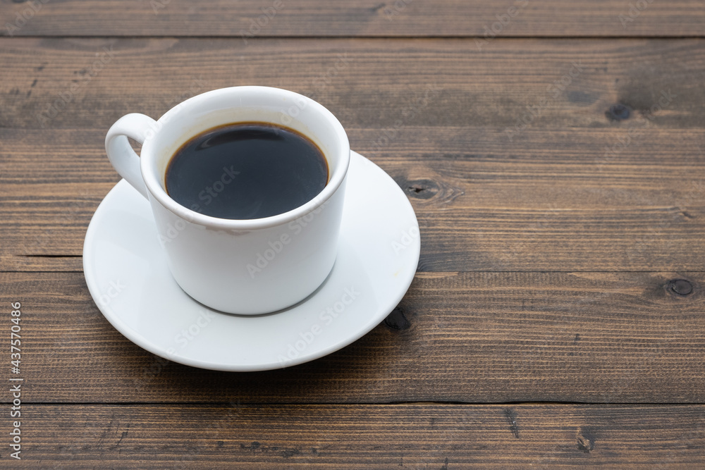 Top view of white coffee cup on wooden background Top view of white coffee cup on wooden background