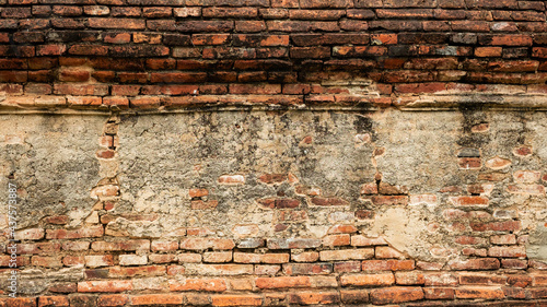 Brick block wall with cracked mortar