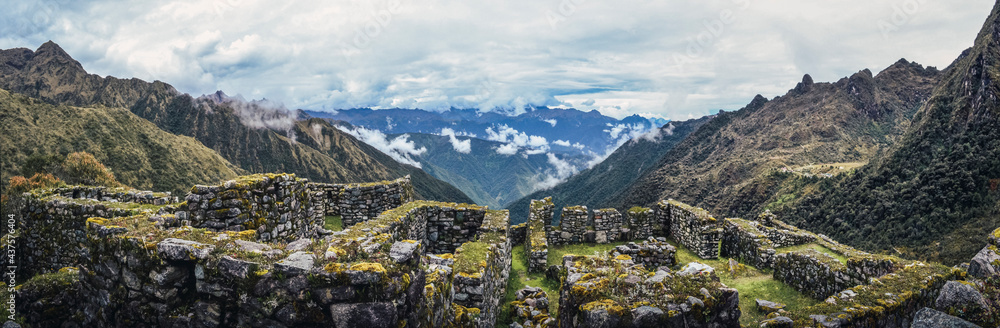 Panoramic human view of the valley on Phuyupatamarca ruins. Inca trail to Machu Picchu archaeological site from the Inca's ancient civilization in Peru. South America