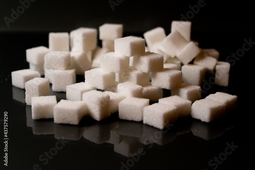 Sugar cubes in different arrangements and colored light. Bavaria Germany . Arrow  Pile  Cube  Square 