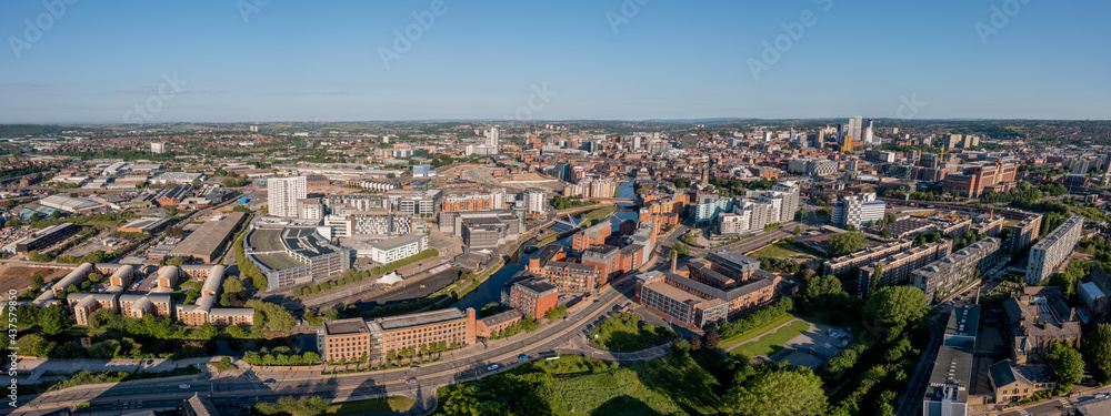 Aerial view of Leeds city centre on a sunny day looking west from near the A64 towards the Armouries, Bridgewater Place and Crown Point. Developing modern Yorkshire city