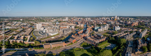Aerial view of Leeds city centre on a sunny day looking west from near the A64 towards the Armouries, Bridgewater Place and Crown Point. Developing modern Yorkshire city
